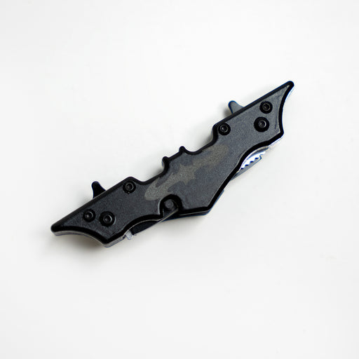 A bat-shaped utility knife and throwing weapon. The blades are hidden.