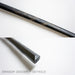 Closeups of the black bokken with dragon design, showcasing the design and the tip of the end.