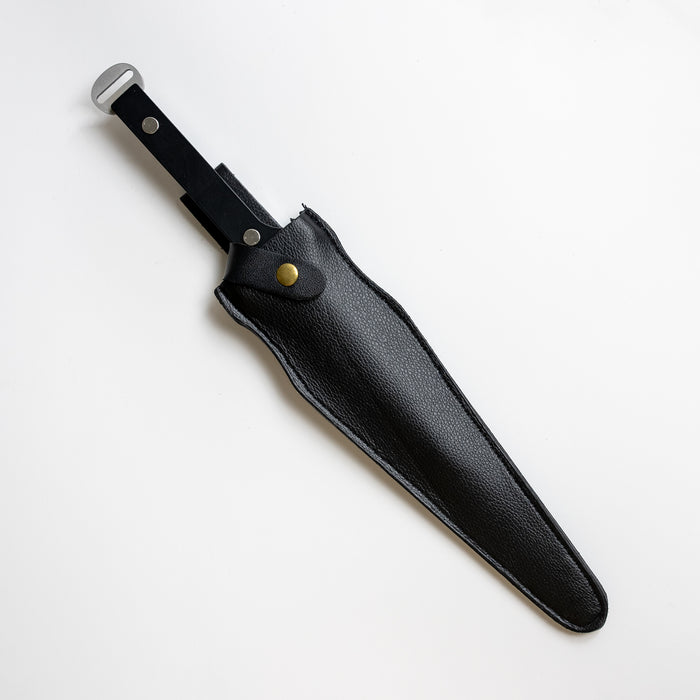 Joker’s Dagger sheathed within the leather carrying case.