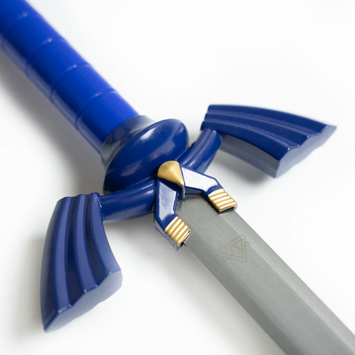 Closeup of the guard of Link’s Master sword, including the triforce insignia on the blade.