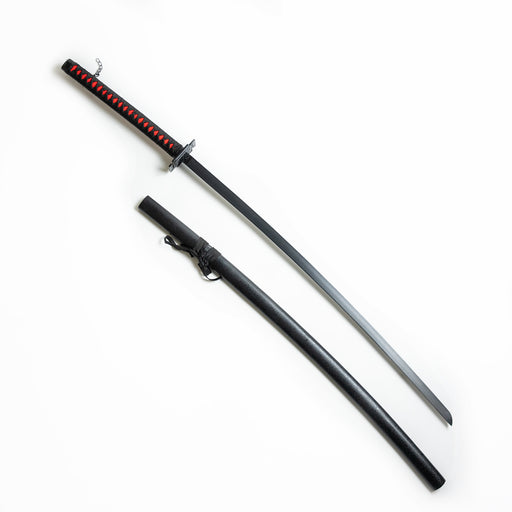 Kurosaki Ichigo’s Tensa Zangetsu Nodachi. A black sword with a manji guard and red and black handle, with a chain hanging off the end.