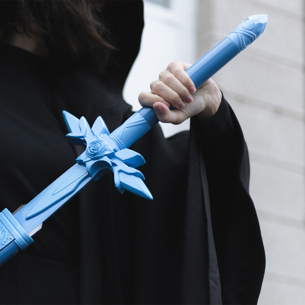 The Blue Rose sword from Sword Art Online wielded by a hooded figure. The blue rose sword is a bright blue sword with rose-themed accents.